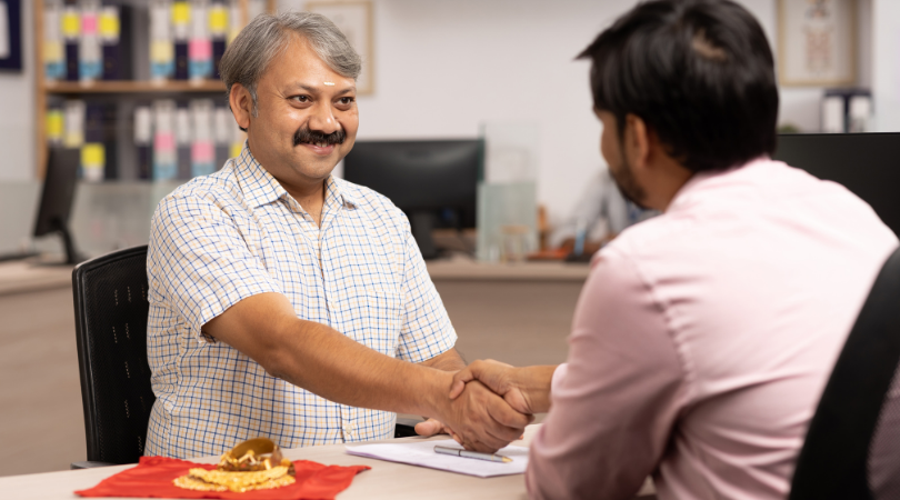 Reviewing financial documents at a desk